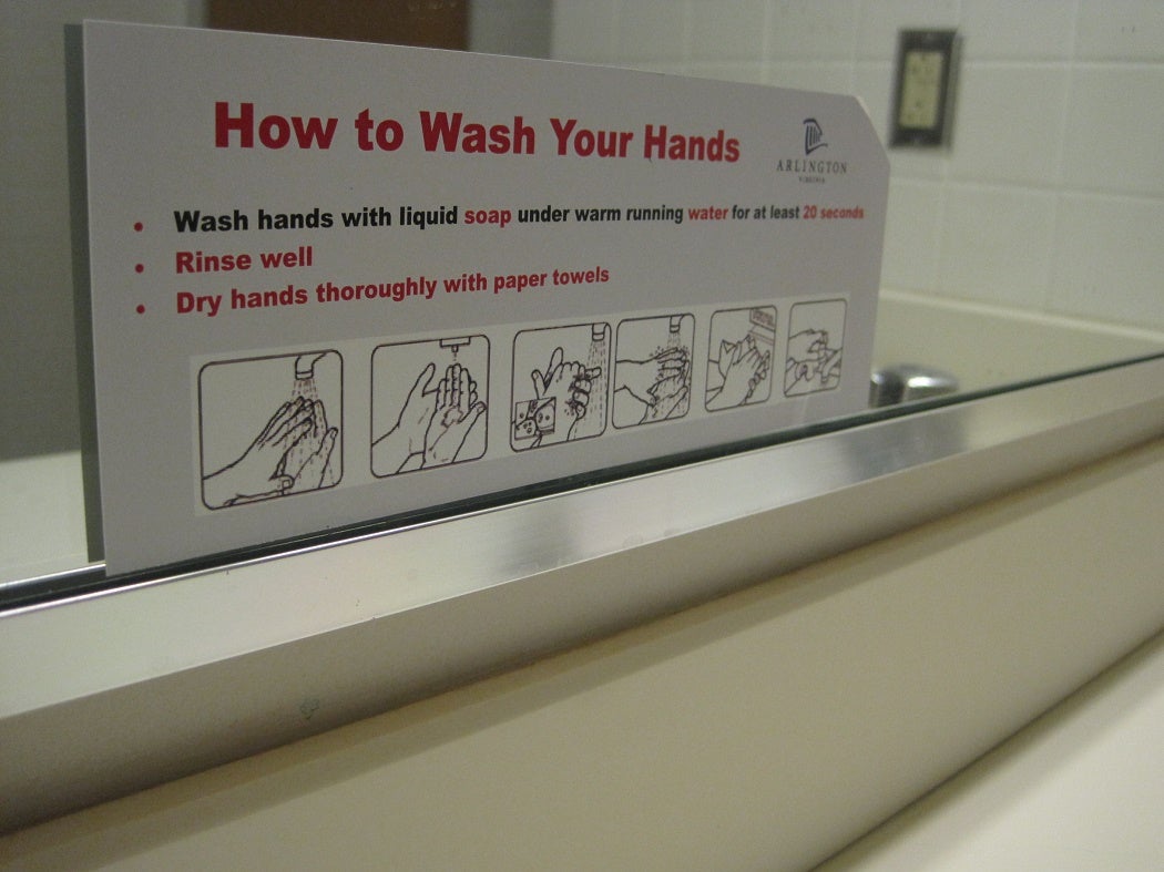 Bathroom sign with instructions on how to properly wash hands.