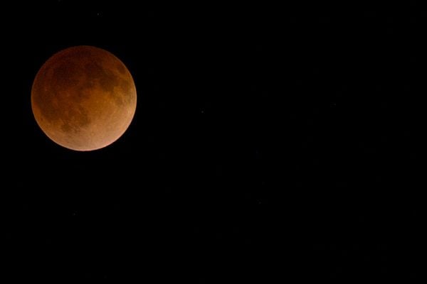 A full blood moon in the night sky