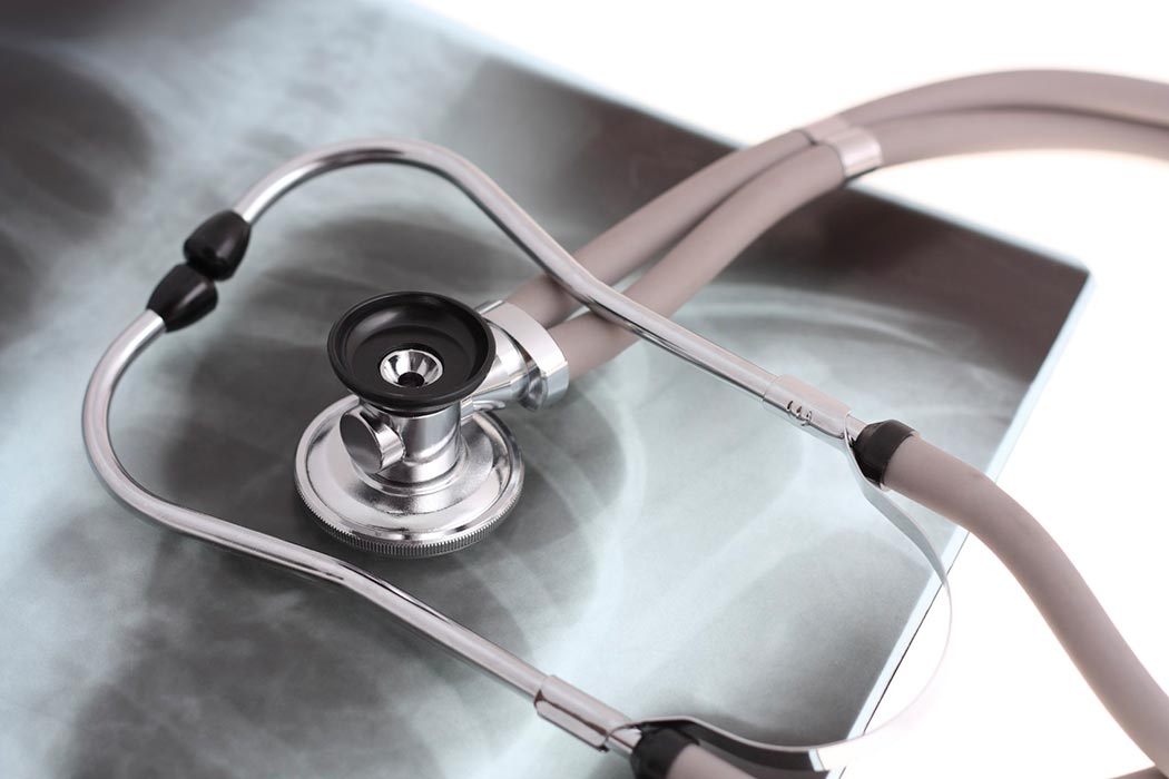 Stethoscope on top of a chest x-ray