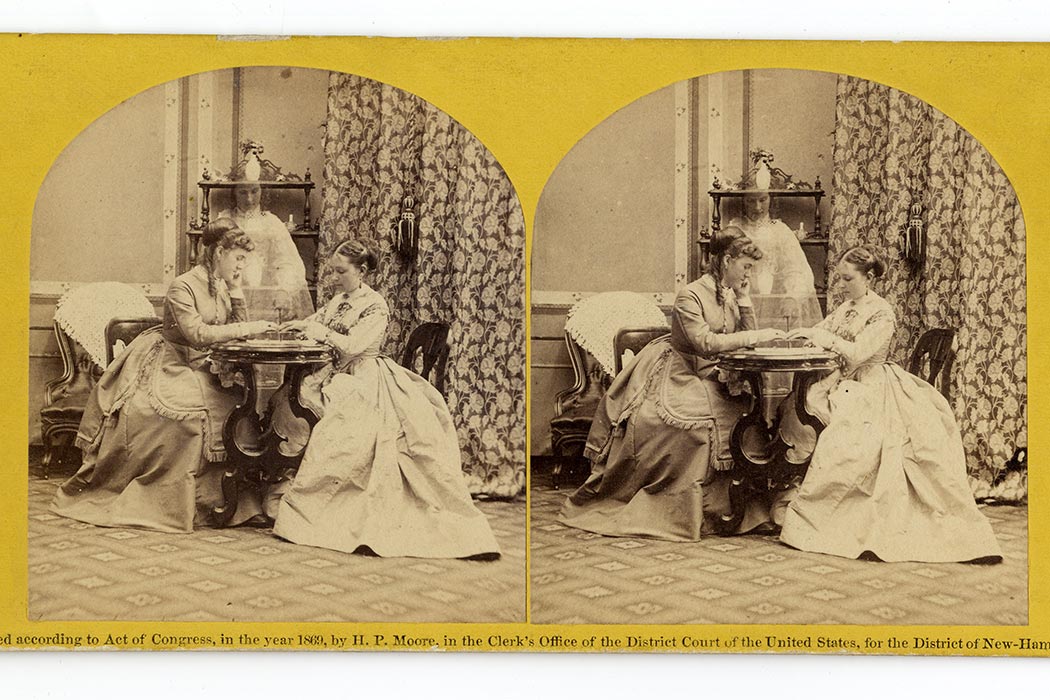 Side-by-side black and white photographs from the mid 1800's of two ladies sitting across from each other and dabbling in divination as a specter-like presence hovers between them