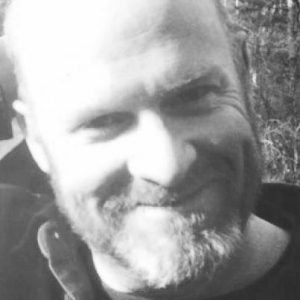 Black and white headshot of author Christopher Maloney