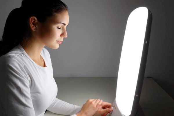 Woman receiving light therapy.