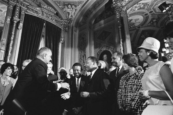 Lyndon Johnson and Martin Luther King Jr. set to shake hands