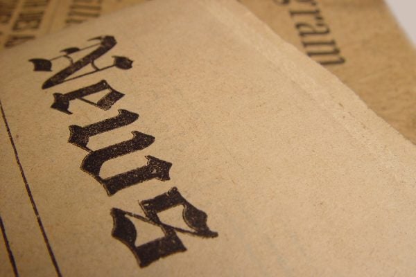 The word "news" in old typeface on aged paper