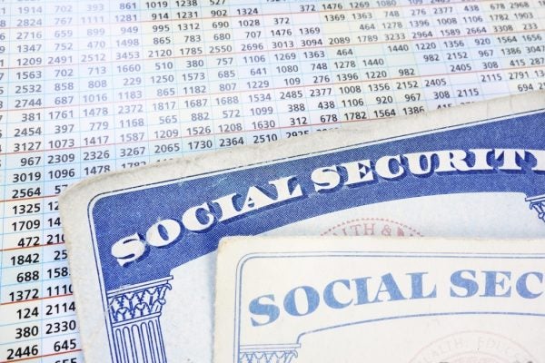 Social Security cards and a sheet of budget numbers