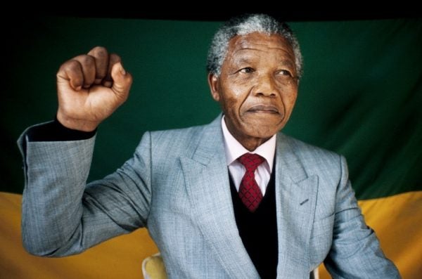 Nelson Mandela with his right fist raised