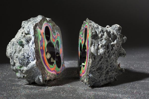 Sculpture of a geode divided in two with various neon colors inside; artist Elyse Graham