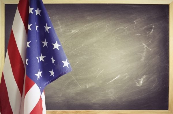 American flag in front of a chalkboard