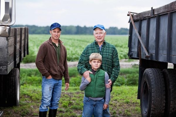 Three generations of men on family farm