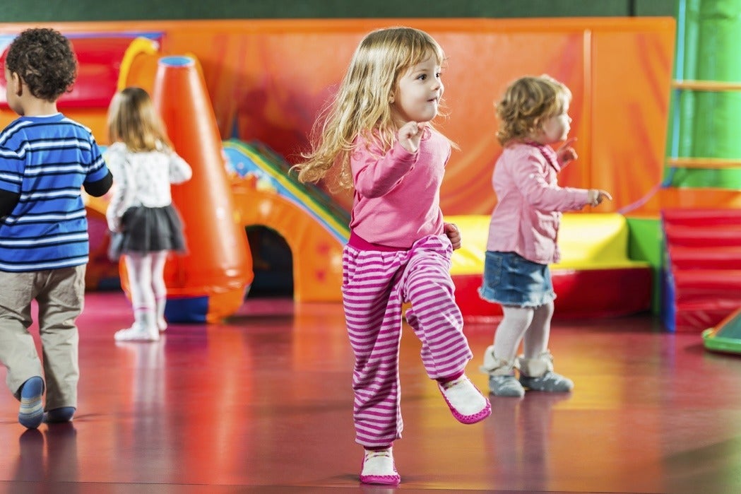 Children dancing in a playroom