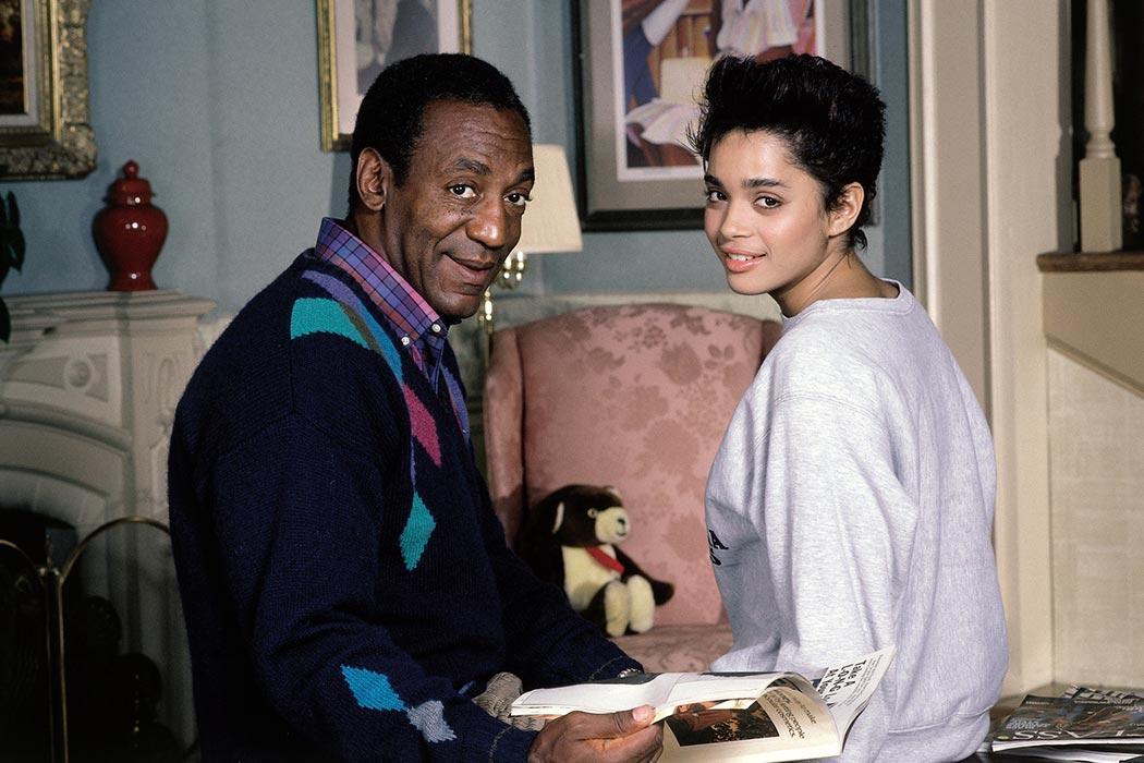 Bill Cosby sitting across from Lisa Bonet