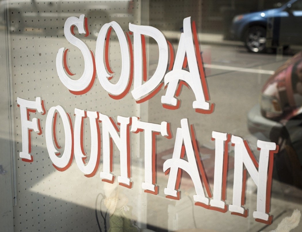 "Soda Fountain" painted on the front of a store