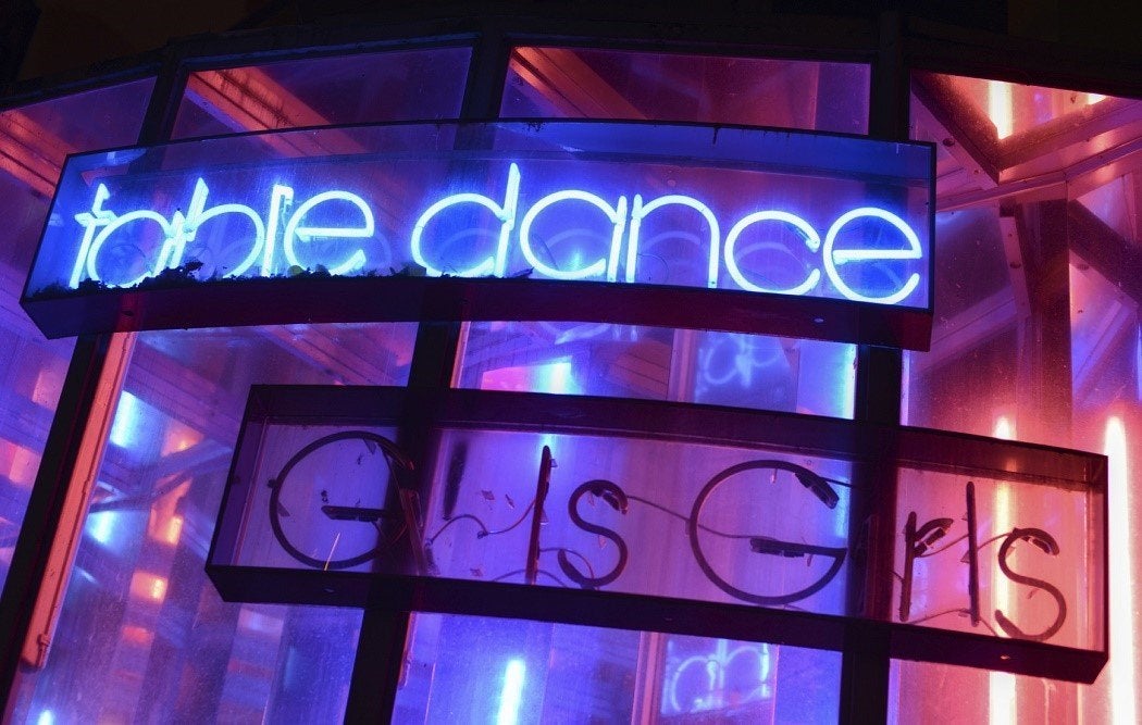 Neon signs at a strip club