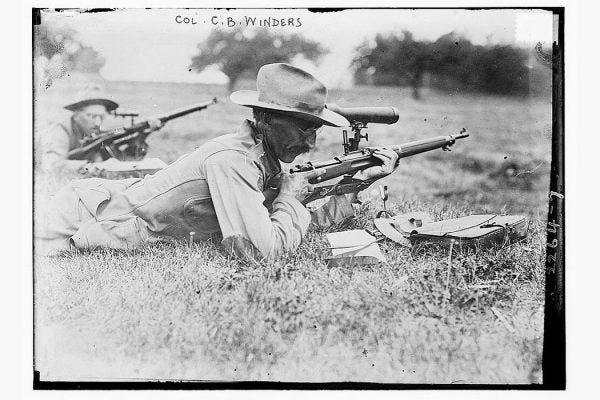 New York area marksman C.B. Winder shooting a gun. 
Photo Credit: George Grantham Bain Collection (Library of Congress)