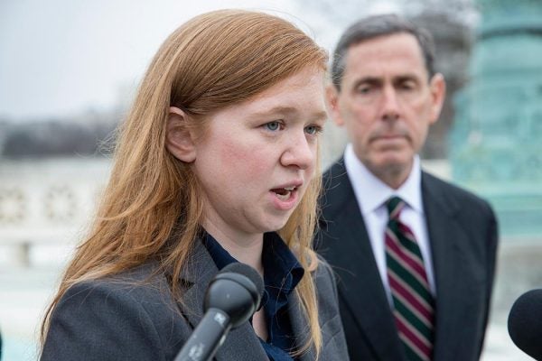 Abigail Fisher, who challenged the use of race in college admissions, joined by lawyer Edward Blum, right, speaks to reporters outside the Supreme Court in Washington, Wednesday, Dec. 9, 2015, following oral arguments in the Supreme Court in a case that could cut back on or even eliminate affirmative action in higher education. (AP Photo/J. Scott Applewhite)