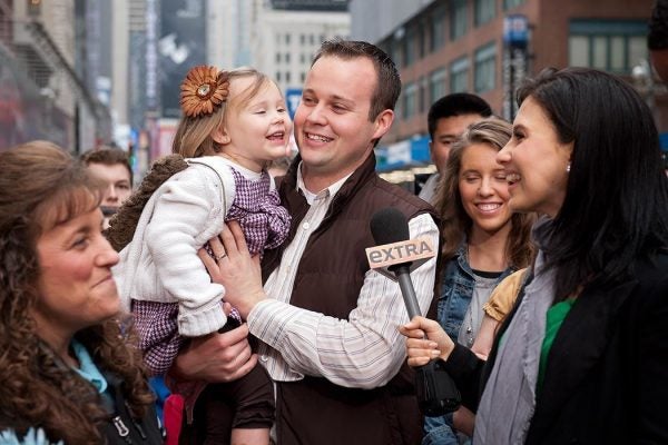 Hilaria Baldwin (R) interviews Josh Duggar and his daughter during their visit with "Extra" in Times Square on March 11, 2013 in New York City. (Photo by D Dipasupil/Getty Images for Extra)