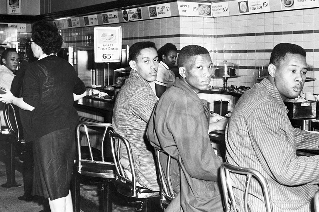 African-American students at North Carolina A&T College participate in a sit-in at a F. W. Woolworth's lunch counter reserved for white customers in Greensboro, North Carolina. (Copyright Bettmann/Corbis / AP Images)