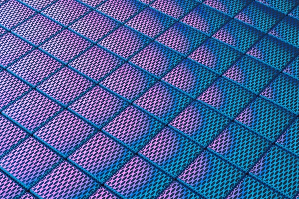 Vivid gradient lighting on perforated metal tiles creates a geometric pattern.