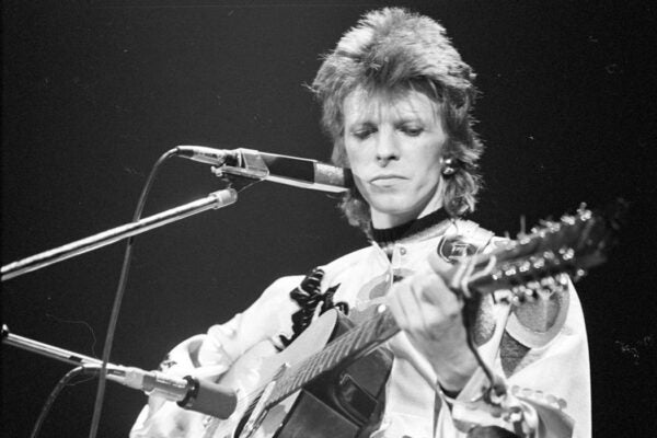 Musician David Bowie performs onstage during his "Ziggy Stardust" era in 1973 in Los Angeles, California