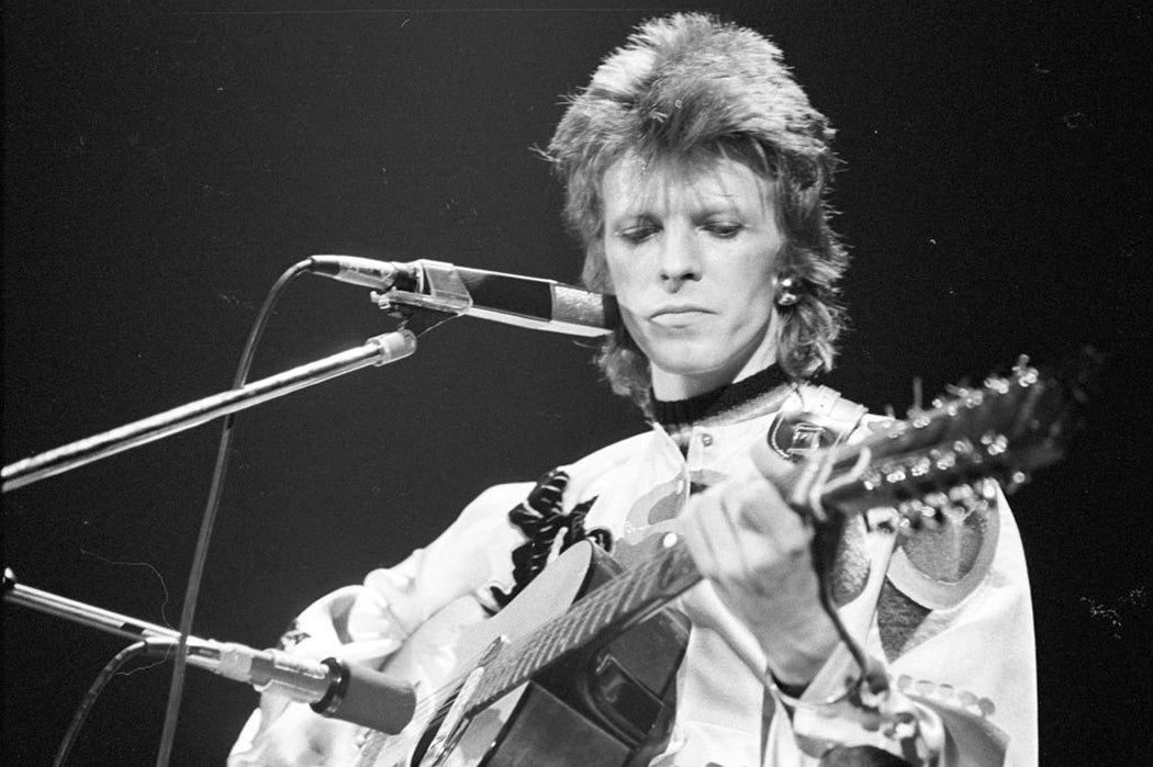Musician David Bowie performs onstage during his "Ziggy Stardust" era in 1973 in Los Angeles, California