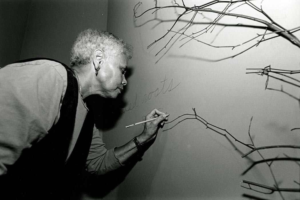 Award-winning artist Betye Saar, shown here setting up her "Tangled Roots" exhibit at the Palmer Museum of Art on the University Park campus of Penn State in 1996.