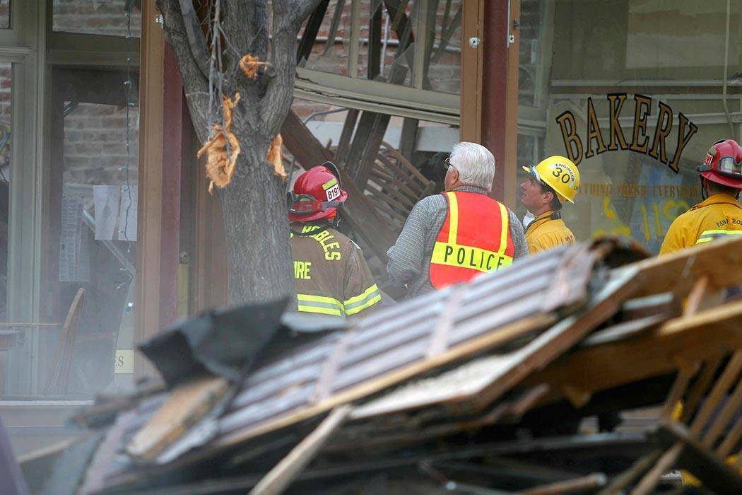 PASO ROBLES, CA - DECEMBER 22: Rescue workers survey damage while searching for survivors December 22, 2003 in Paso Robles, California. The 6.5 richter scale earthquake hit the central coast of California earlier today killing at least two people. (Photo by Rod Rolle)