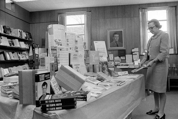 Mrs. Rose O'Brine works in the bookstore at the John Birch Society in Belmont, Mass., April 14, 1976. (AP Photo/J. Walter Green)