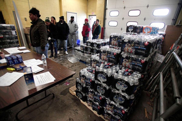 Flint residents get bottled water, water testing kits, and water filters at a Flint Fire Station January 13, 2016 in Flint, Michigan.