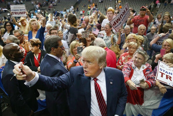 Republican presidential candidate Donald Trump greets supporters during a campaign rally at the American Airlines Center on September 14, 2015 in Dallas, Texas.
