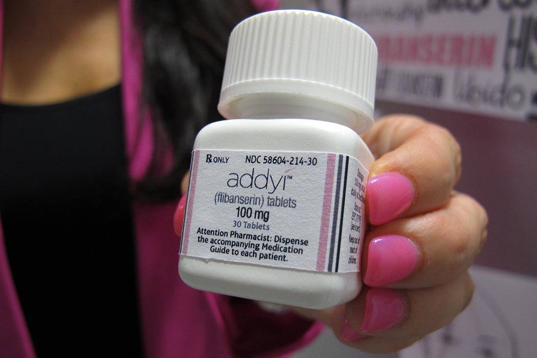 In this Aug. 18, 2015 file photo, Sprout Pharmaceuticals CEO Cindy Whitehead holds a bottle for the female sex-drive drug Addyi at her Raleigh, N.C. Most women with low sexual desire won’t rush out to get the first prescription drug to boost female libido when it launches on Saturday, Oct. 17, 2015. But they may have more options down the road. (AP Photo/Allen G. Breed)