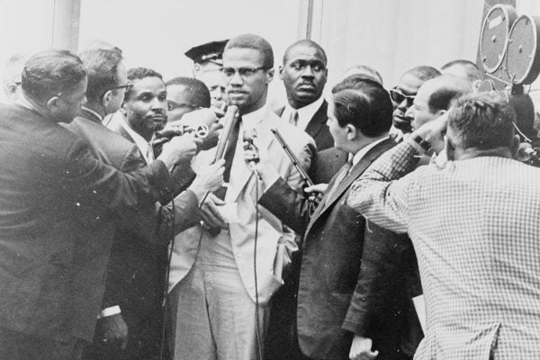 Reporters swarming around Malcolm X