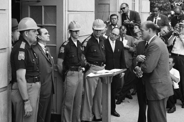 George Wallace in front of a podium