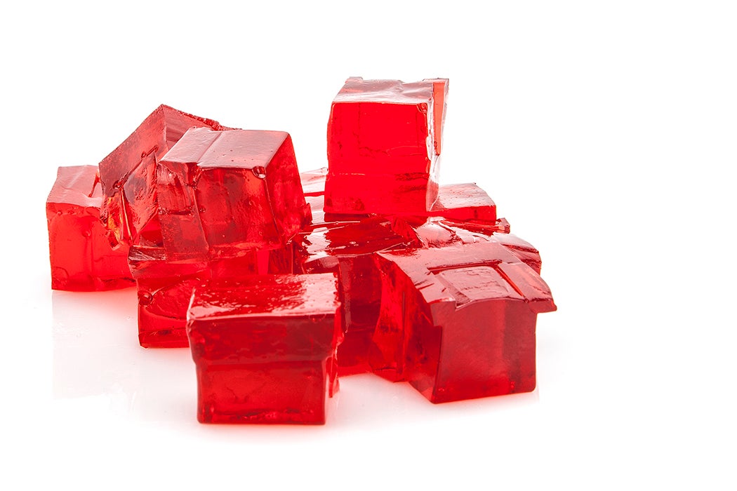 Cubes of red jello on white background