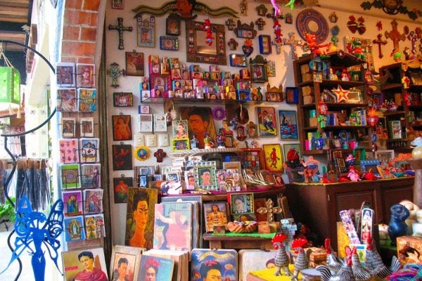 Shop wall covered with Frida Khalo trinkets and souvenirs