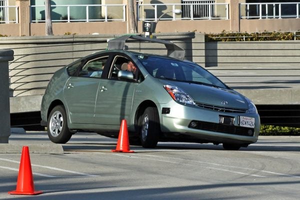 Self driving car navigating its way around safety cones