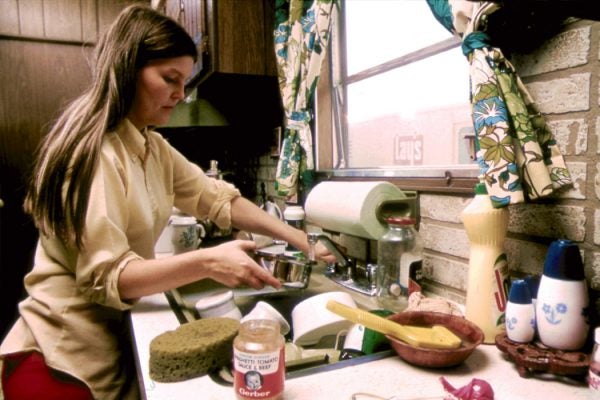 A woman in the kitchen of her mobile home in New Ulm, Minnesota, 1974