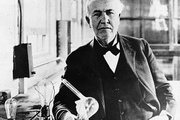 Thomas Edison with lightbulb