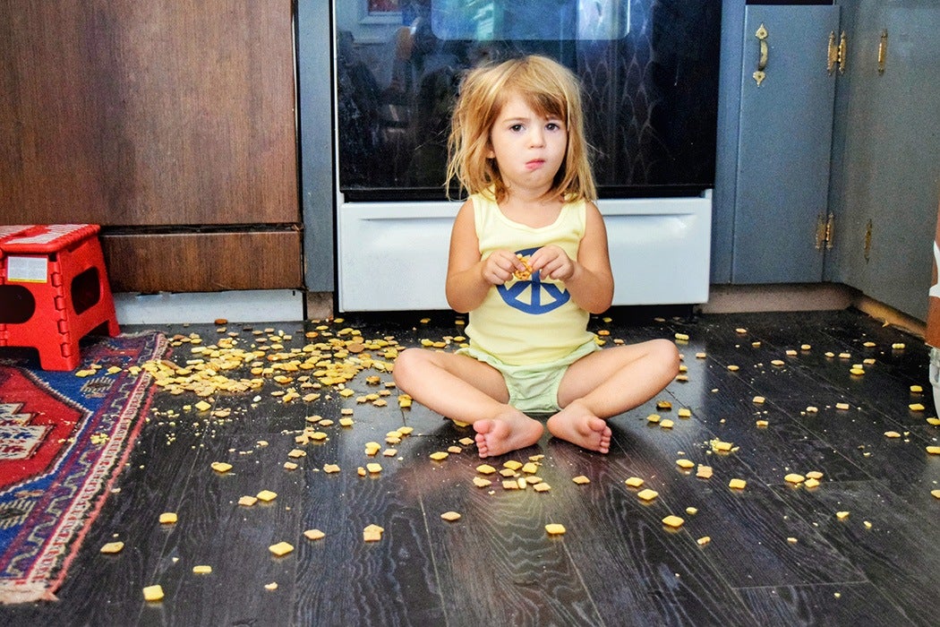 kid with food on floor