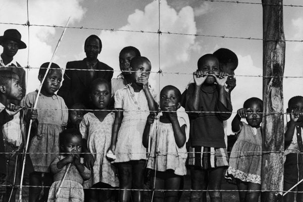 Children behind barbed wire
