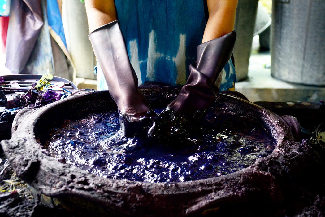 People working Batik dye Mauhom color
