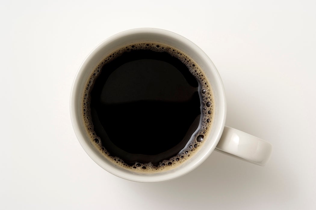 Isolated shot of a cup of coffee on white background