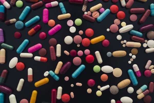 colorful pills on black background