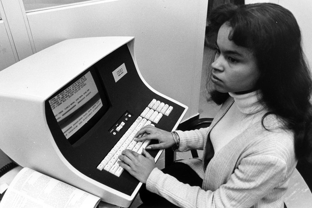 Woman using computer in the 1970s