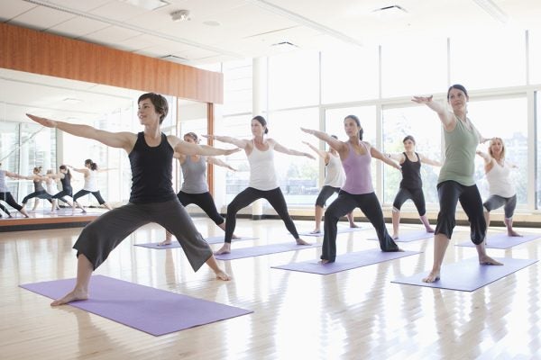 yoga class being led by instructor
