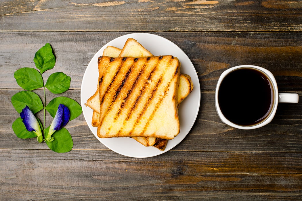 Toast and coffee on wooden background,breakfast or meal