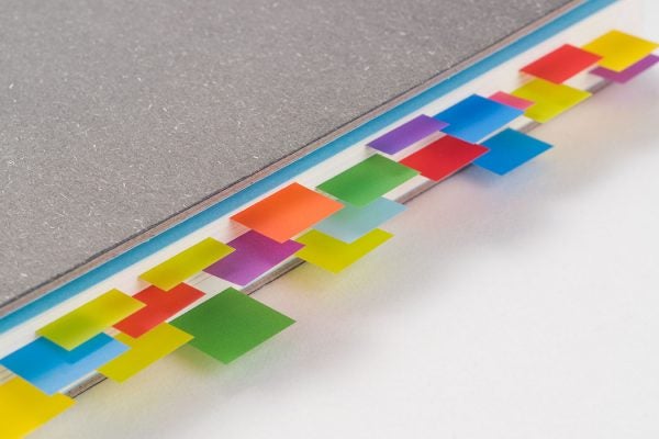 Colorful tabs marking pages in a book
