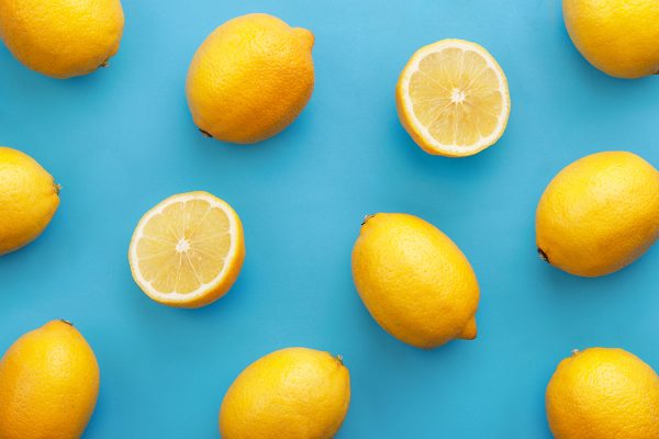 Close-Up Of Lemons On Blue Background