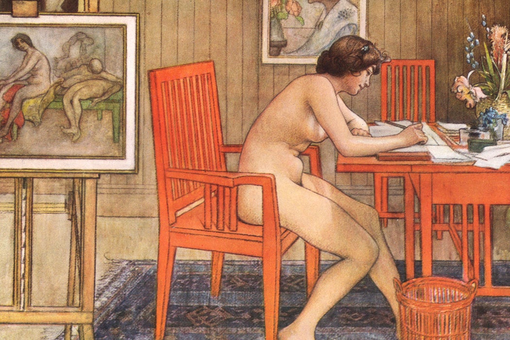 Painting of a nude woman writing at a desk with paintings in the background