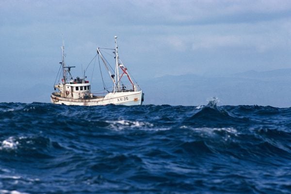 Fishing boat in high seas