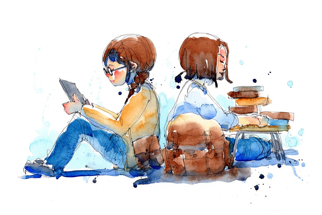 Two young people reading together.